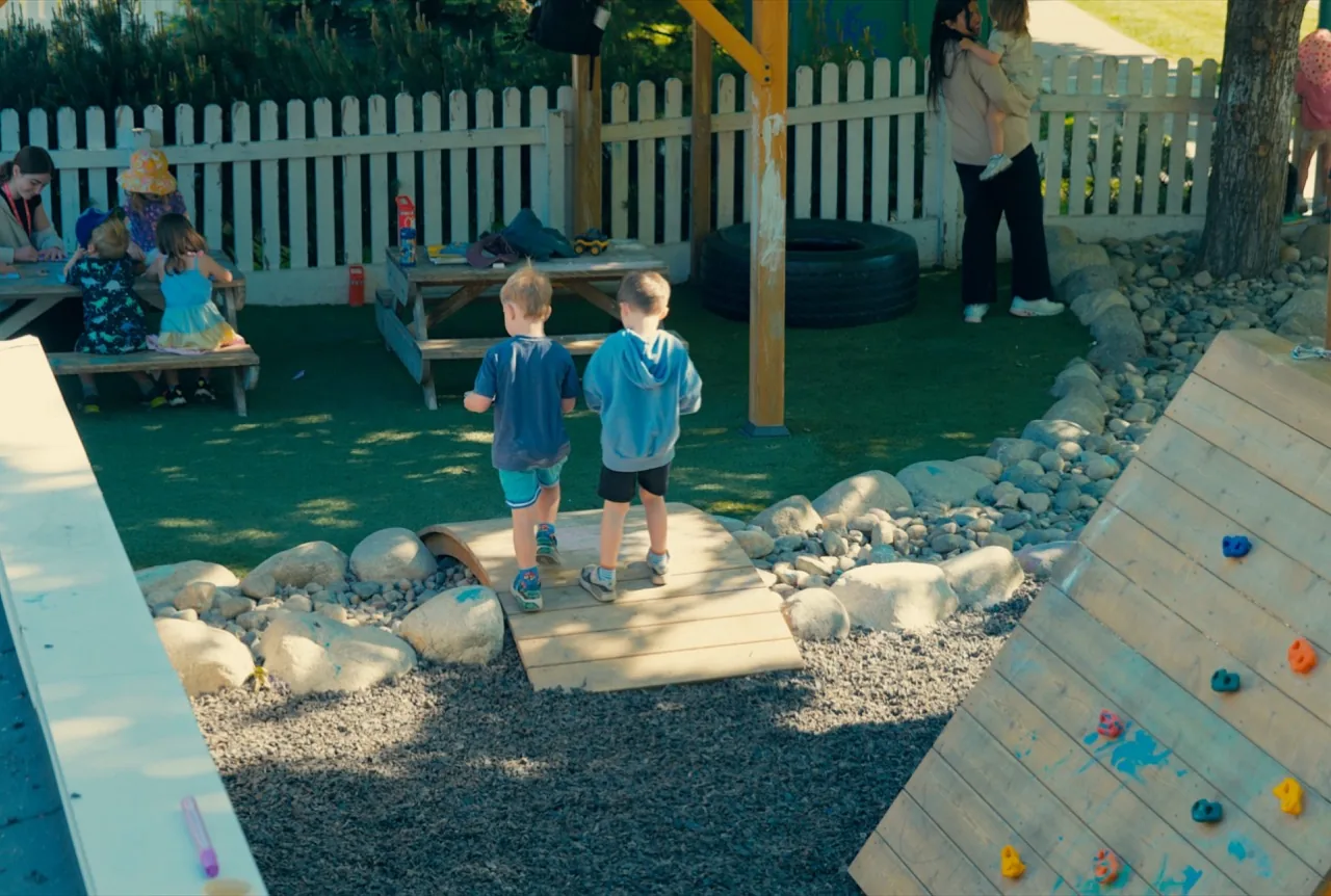 Children crossing a bridge in the Kettle Valley yard